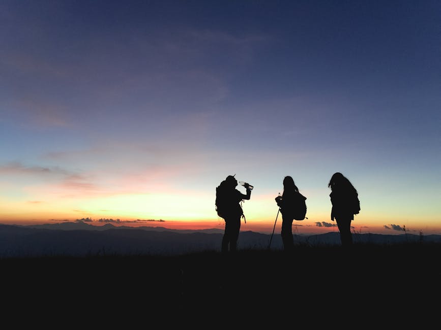 Group hiking at sunset